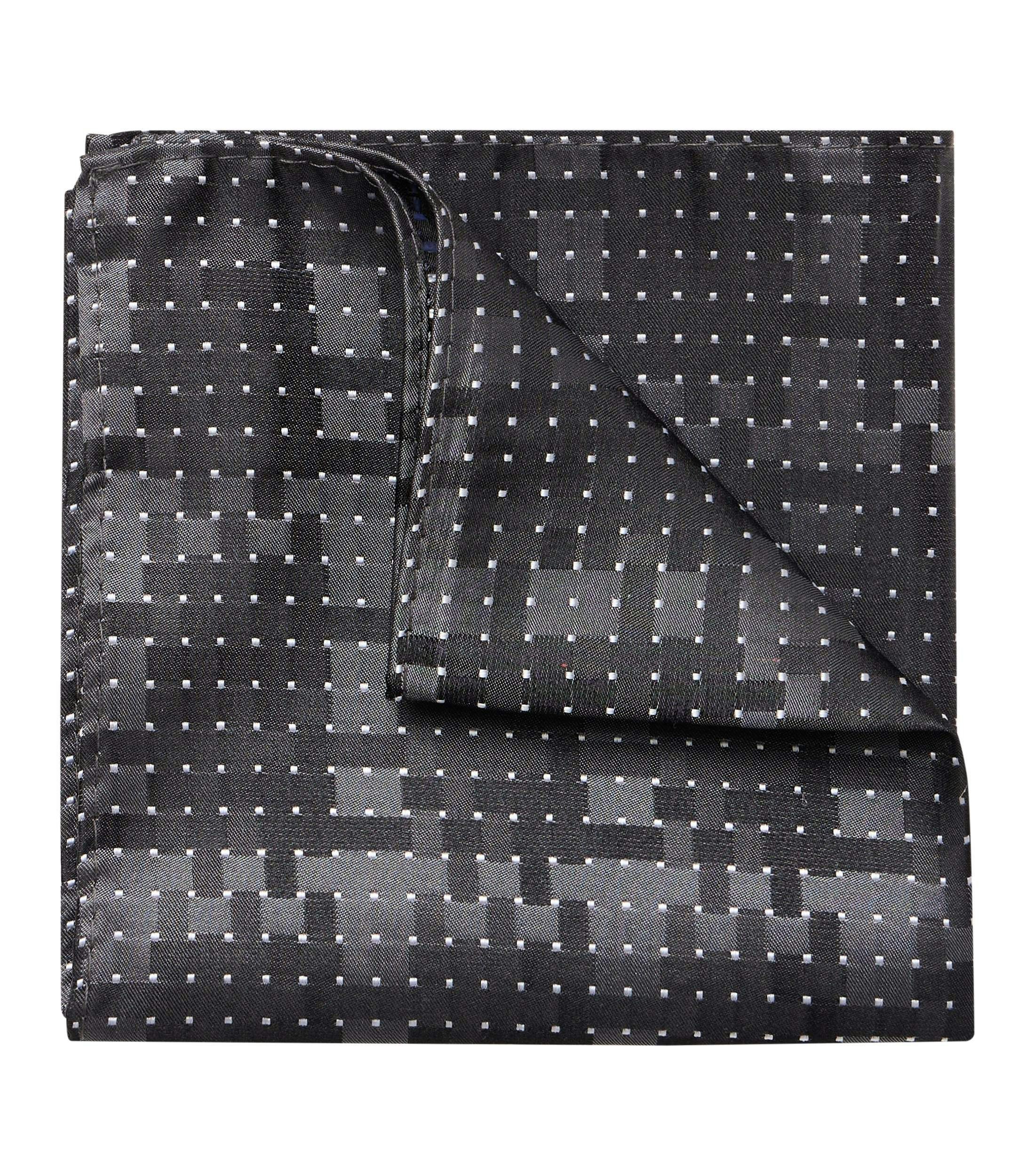 Eine Fliege und Einstecktuch im gemustert Muster in der Farbe Grau