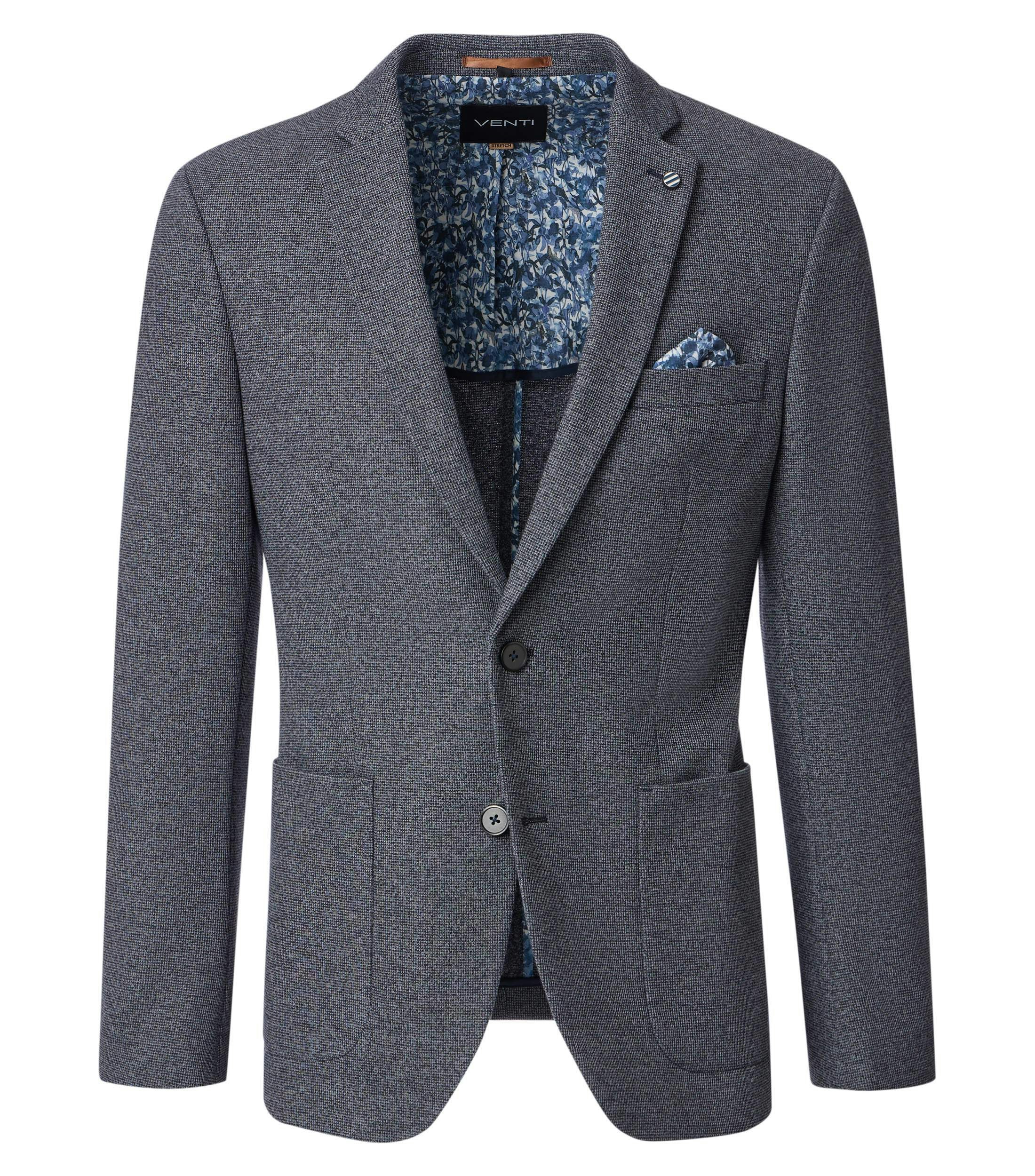 Das Model trägt ein Sakko im uni Muster in der Farbe Grau