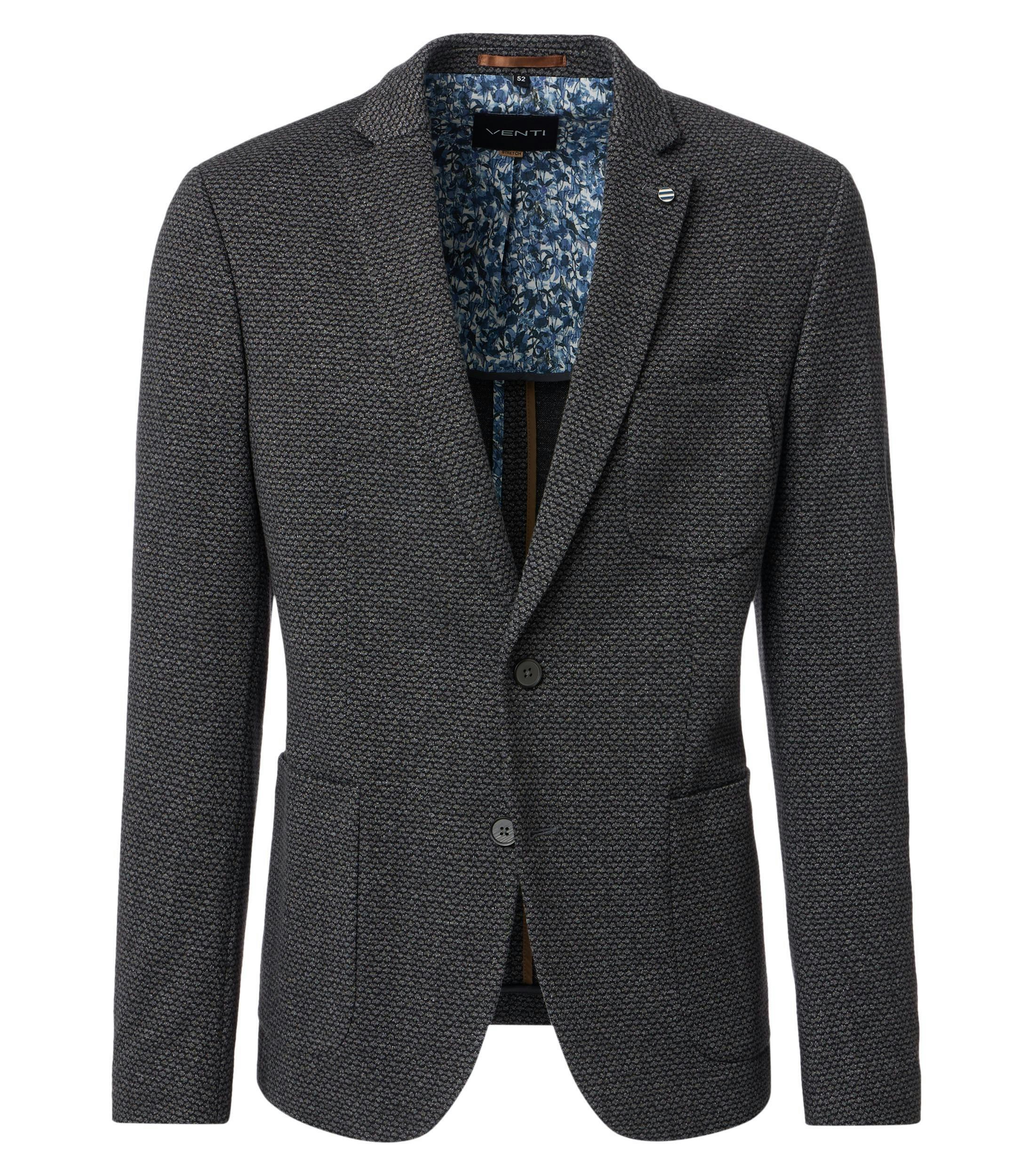 Das Model trägt ein Sakko im uni Muster in der Farbe Dunkelgrau