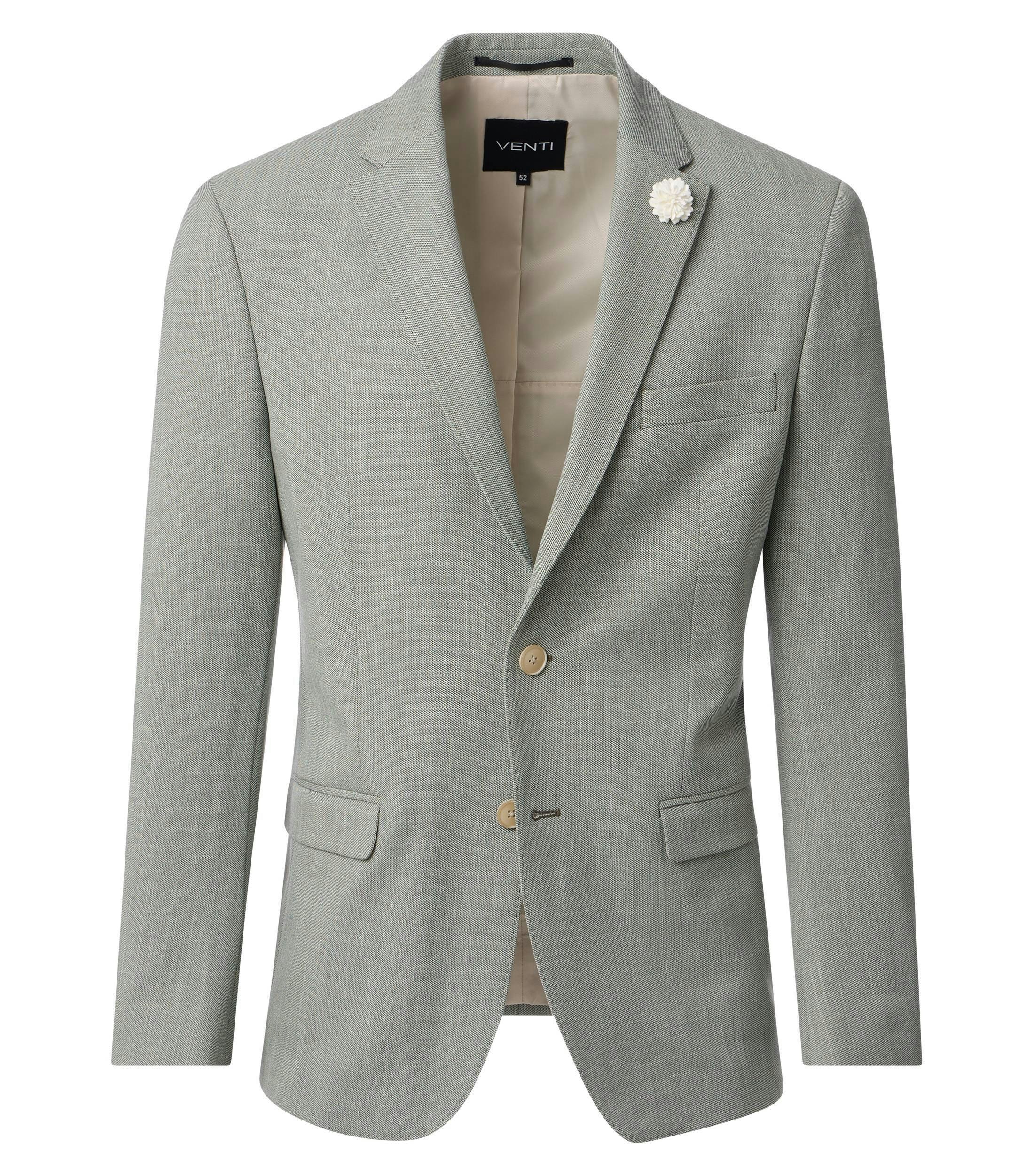 Das Model trägt ein Sakko im uni Muster in der Farbe Grün