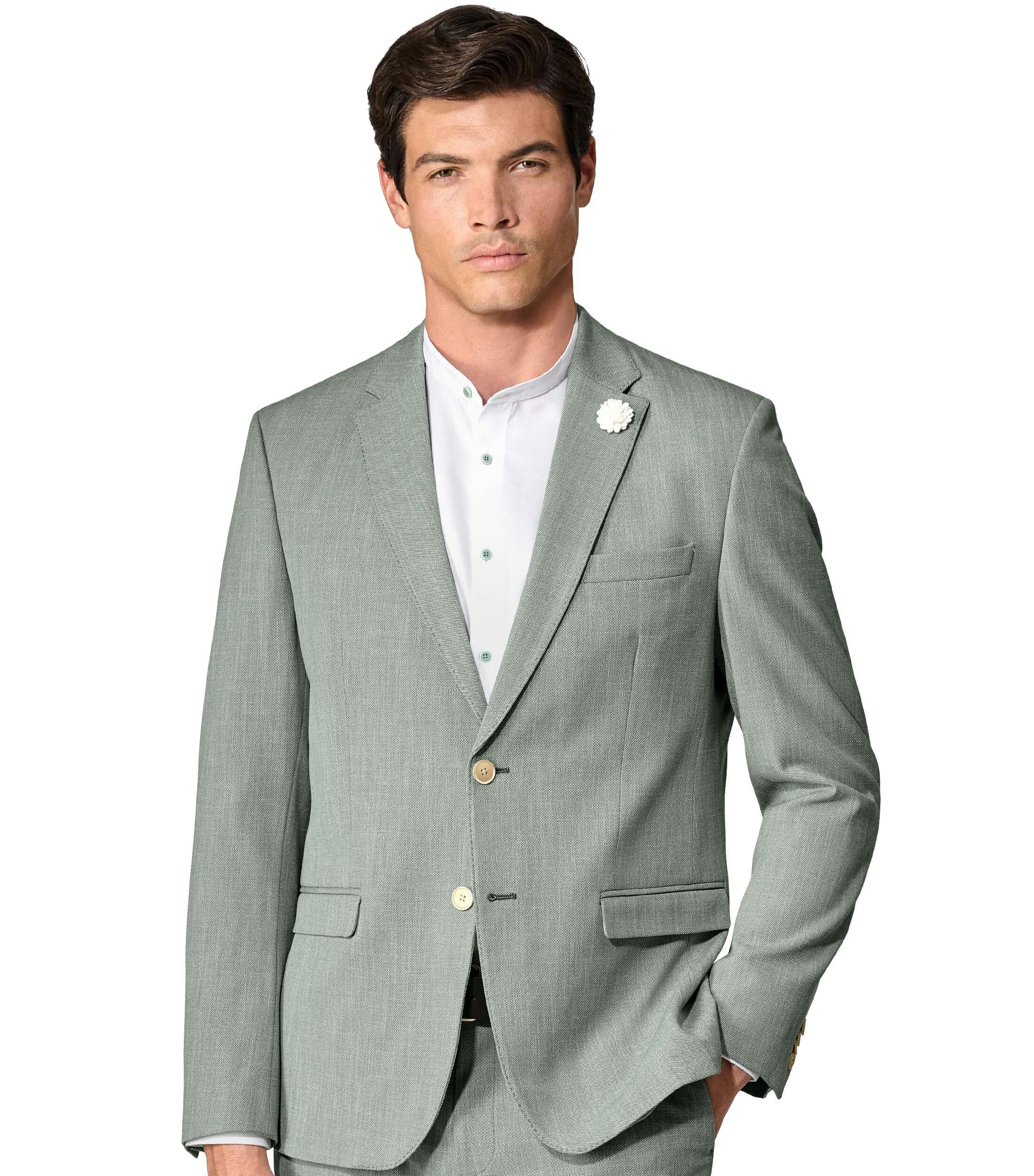 Das Model trägt ein Sakko im uni Muster in der Farbe Grün