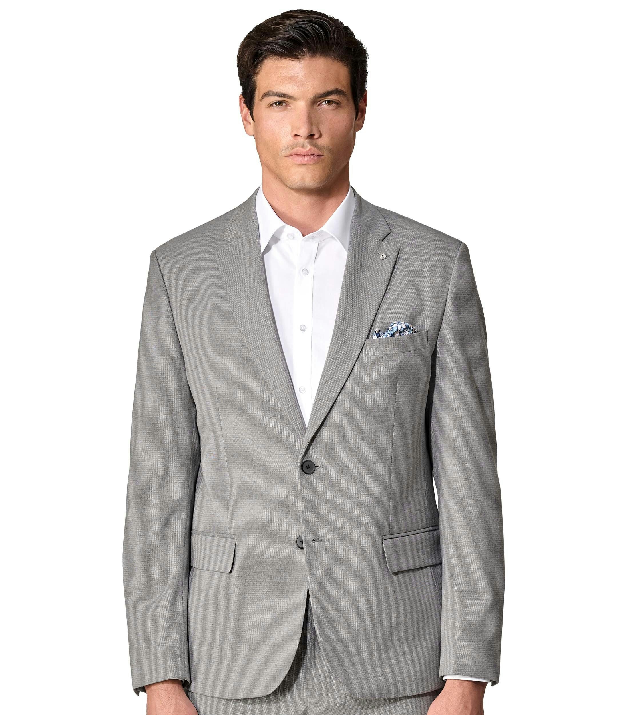 Das Model trägt ein Sakko im uni Muster in der Farbe Grau