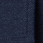 Das Model trägt ein Businesshemd im uni Muster in der Farbe Blau