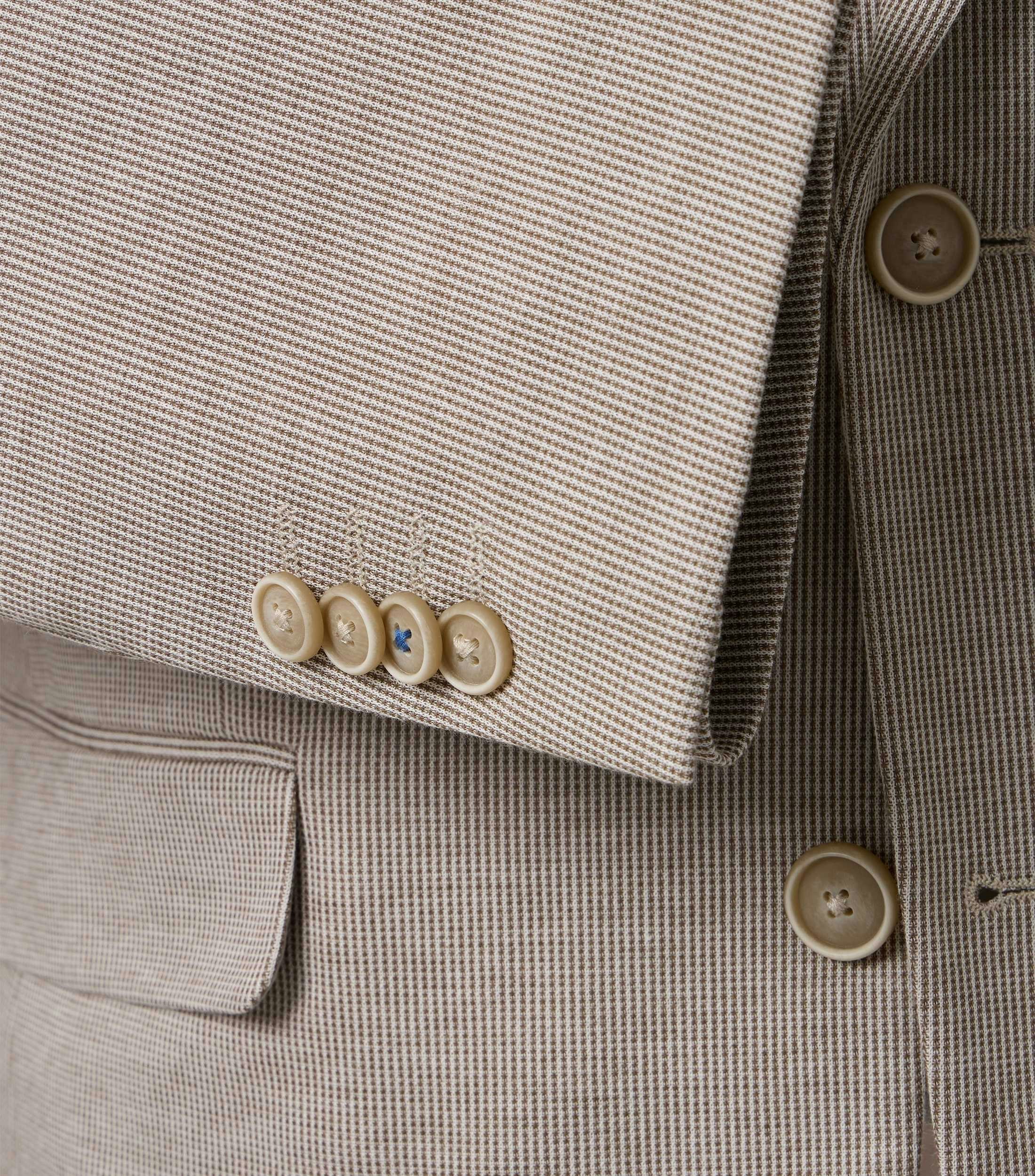 Ein Sakko im uni Muster in der Farbe Beige